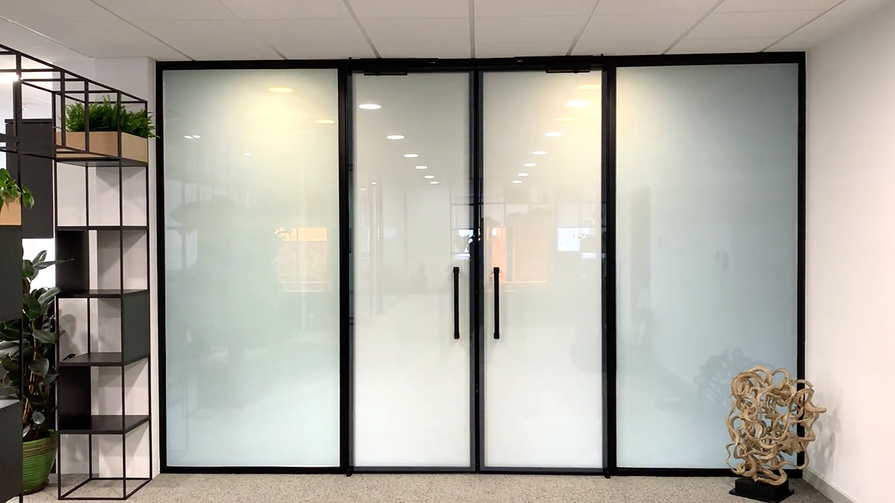 The same glass partition switched to the frosted, private state